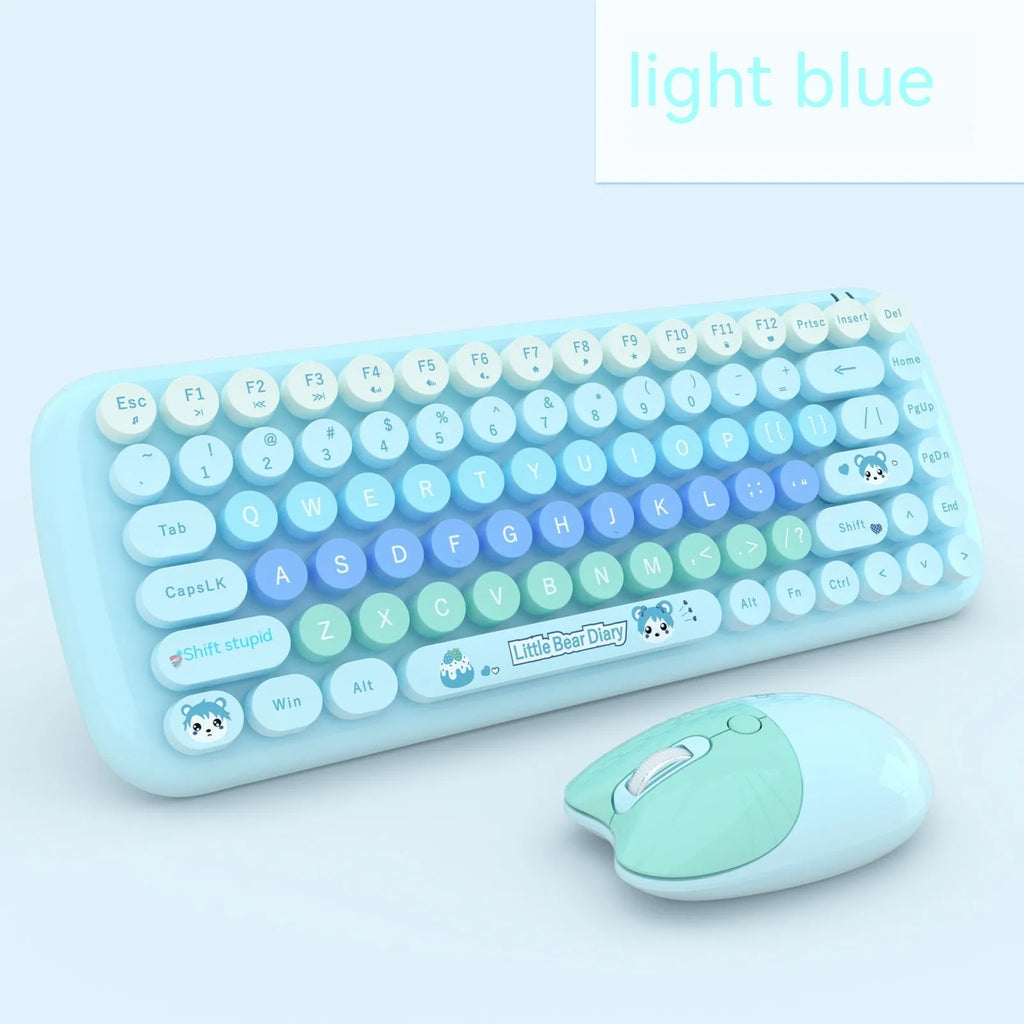 Candy pink wireless keyboard and mouse set with miniature cartoon design on a desk.
