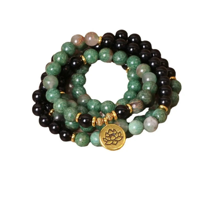 Green and black alloy beaded bracelet with elastic closure showing natural style design
