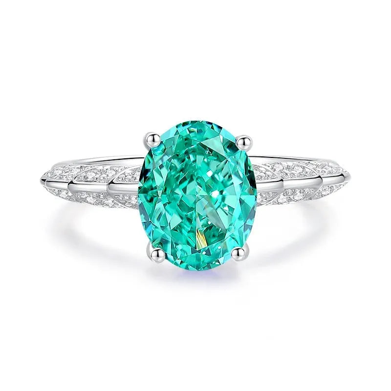 S925 silver emerald ring with high carbon diamond inlay in geometric ellipse shape on model finger.