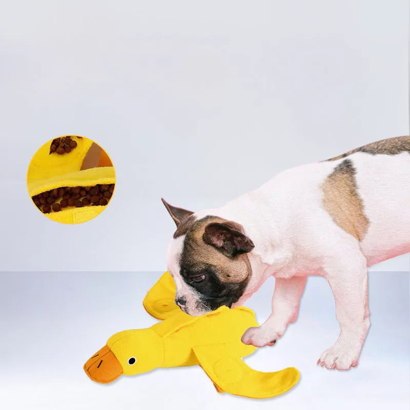 Yellow plush duck dog toy with a treat compartment and built-in sound module for training and enrichment.