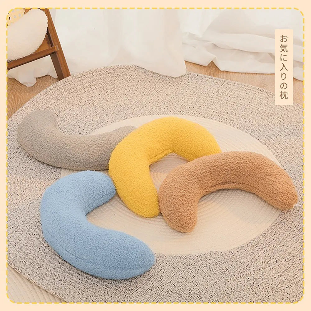 Blue U-shaped cat pillow with an adjustable fabric collar for neck support.