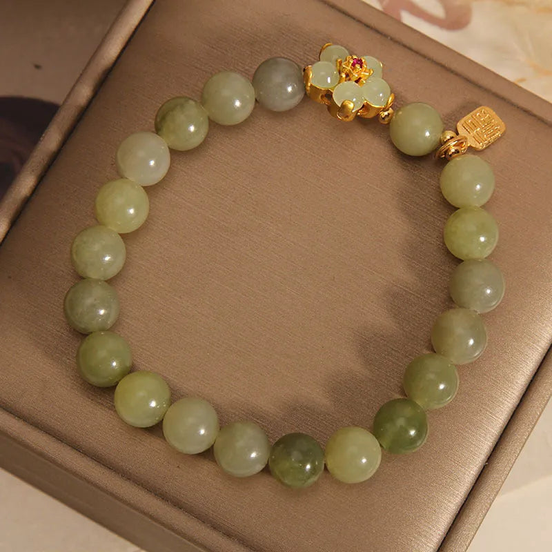 A grey jade coloured alloy bracelet with a casual style for women.