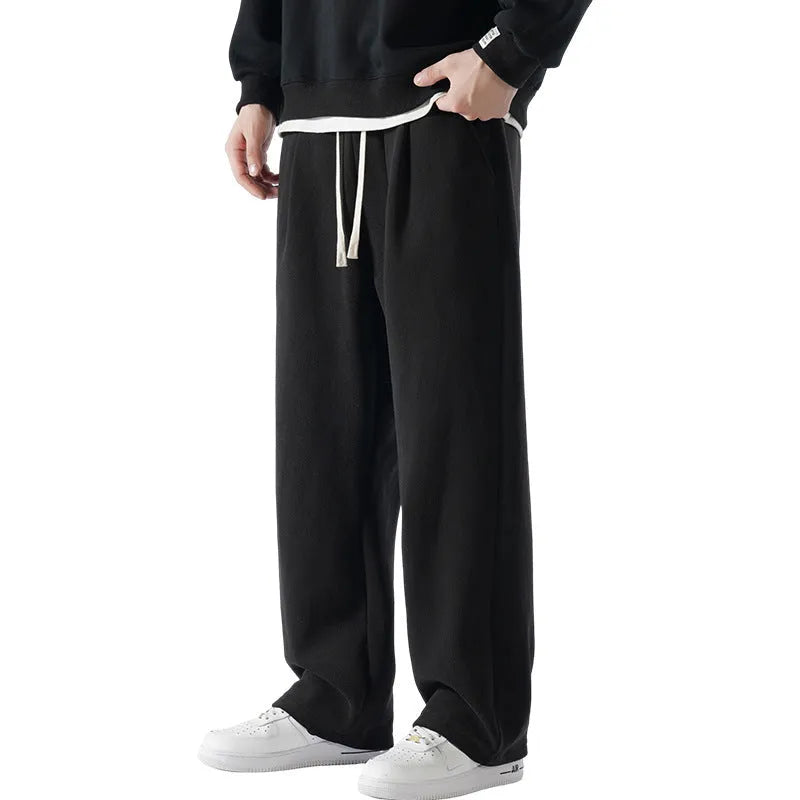Men's apricot coloured fleece-lined loose fit sports trousers with an elasticated drawstring waist.