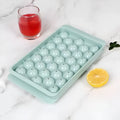 33 grid round silicone ice cube tray with lid in blue or pink measuring 24x14x3cm