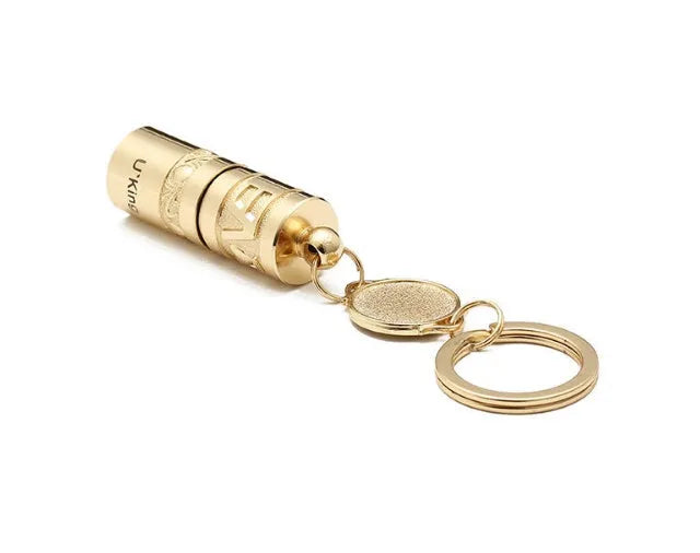 Gold zinc alloy waterproof mini LED flashlight attached to a keyring.
