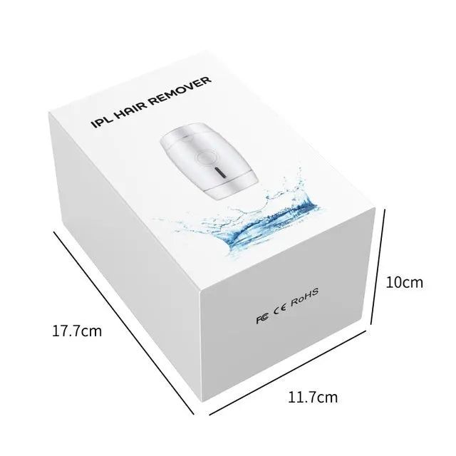 White home laser hair removal device on a table showing its compact size.