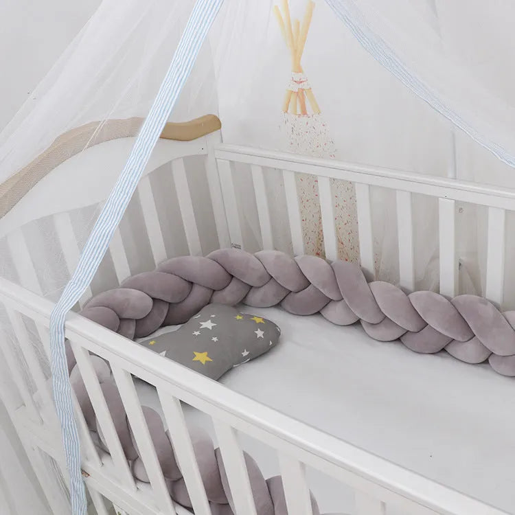 Baby crib bumper in crystal velvet with braid knot design showing flexible length options for cot protection