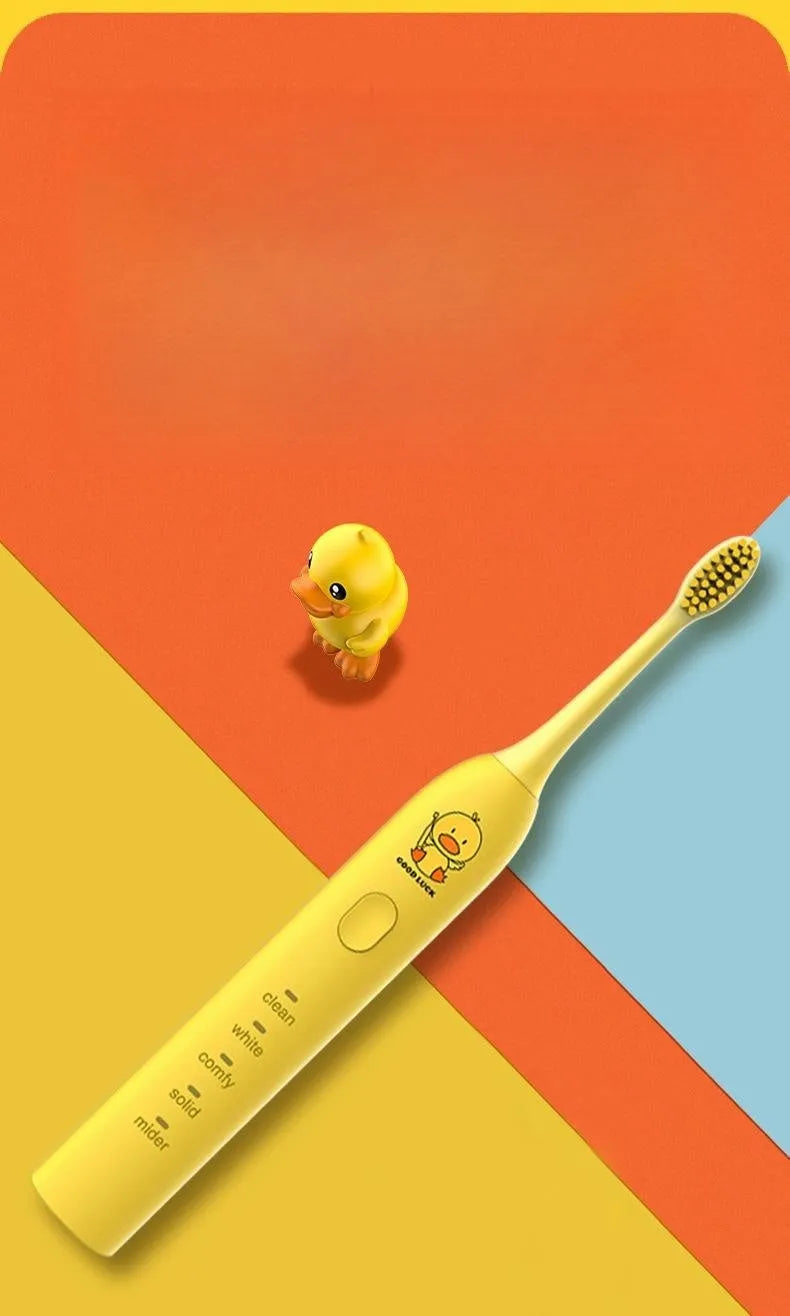 Yellow duck design USB rechargeable electric toothbrush with soft bristles on a bathroom counter.