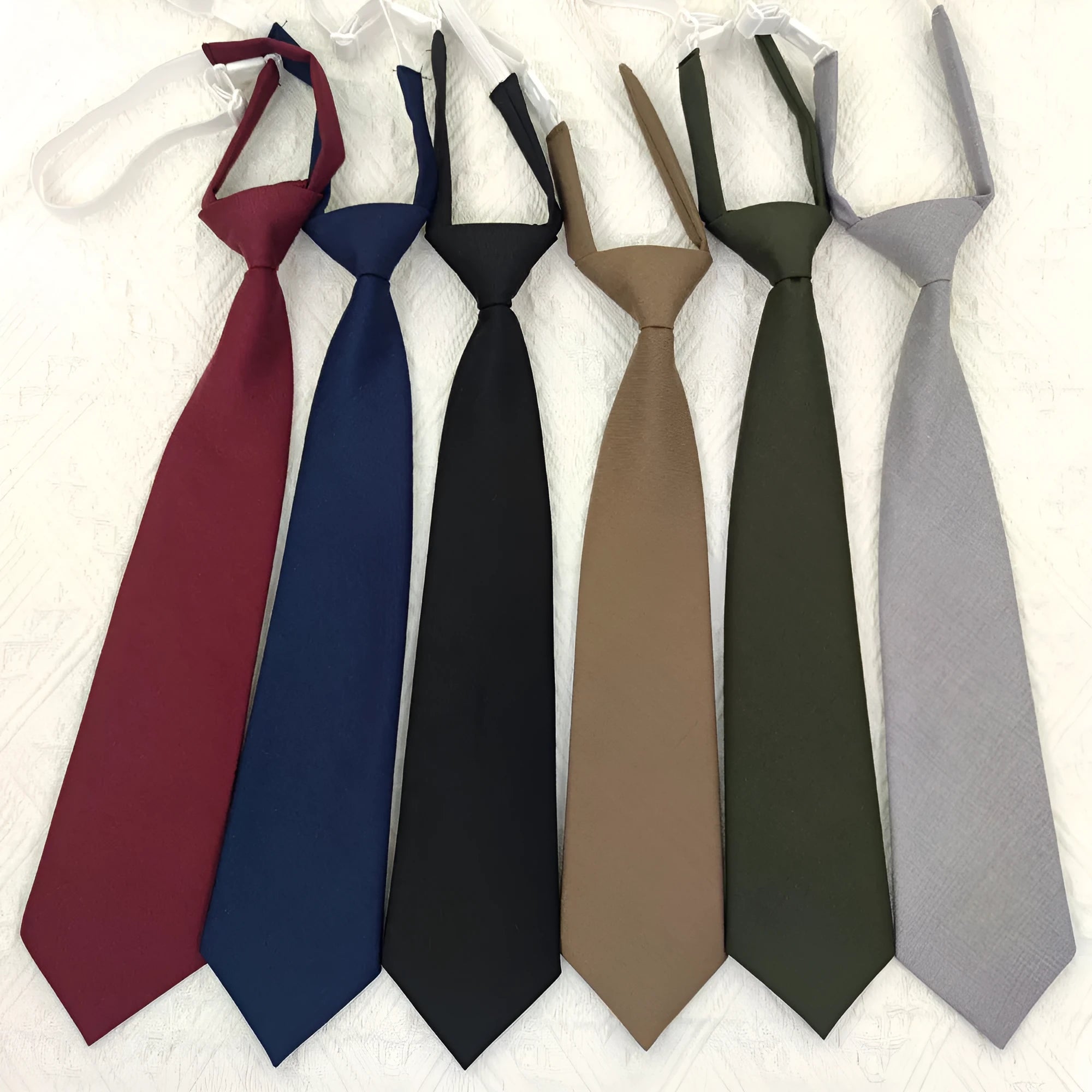 Navy blue cotton bow tie with arrow style shape measuring 35cm by 7cm