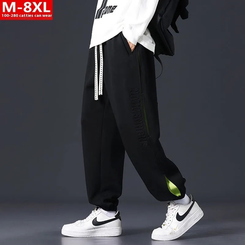 Men's loose cotton trousers with stitching printing design and ankle banded cuffs in black colour