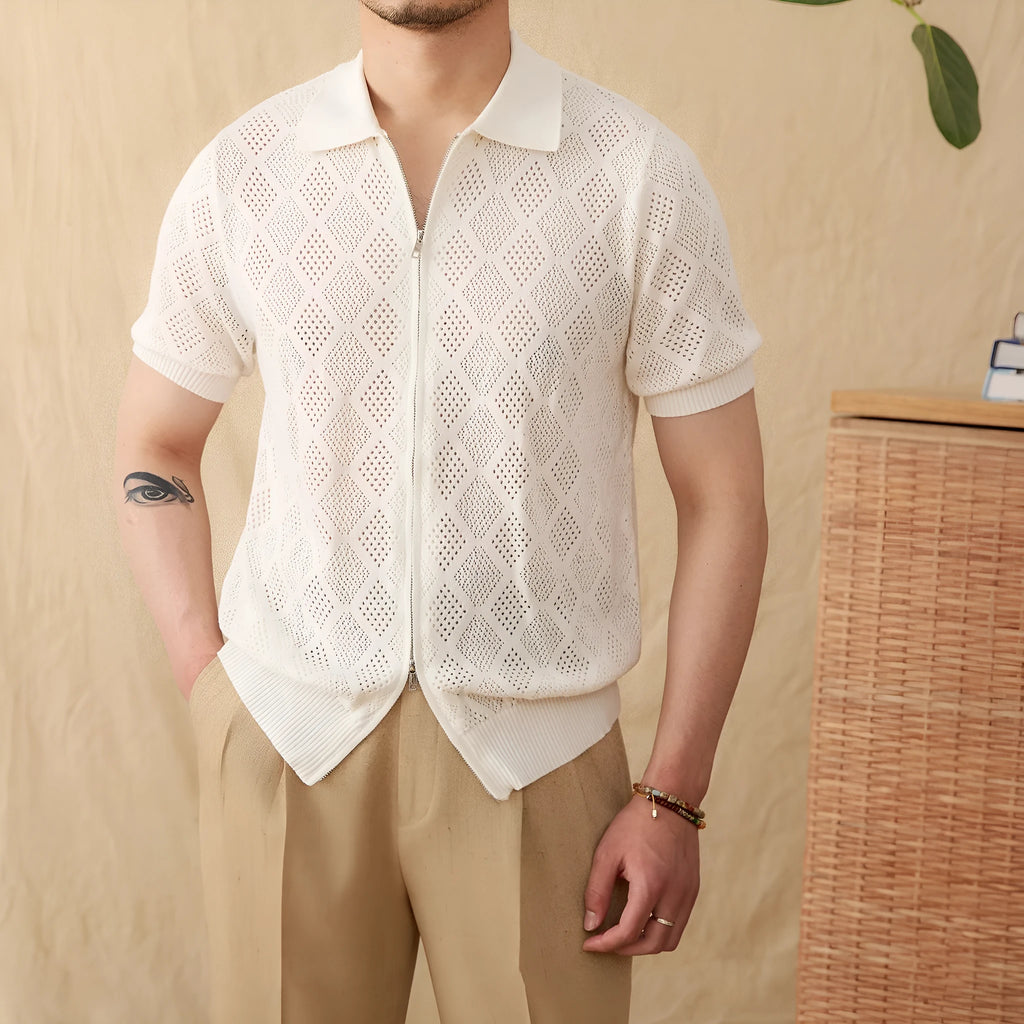 Light brown cotton short sleeve cardigan with zip front and lapel collar laid flat.