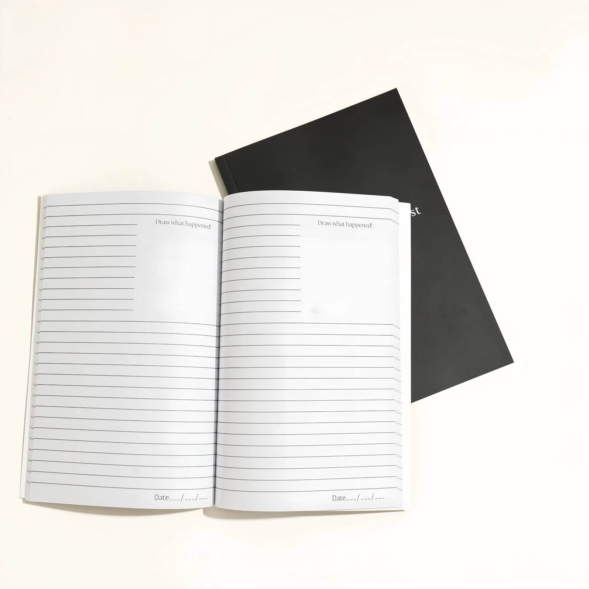 Black A5 hardcover dream journal notebook with elastic closure band.