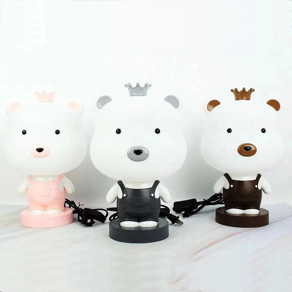 Cartoon animal table lamp in random bear, cattle, rabbit, or tiger design with plastic shade and LED light.