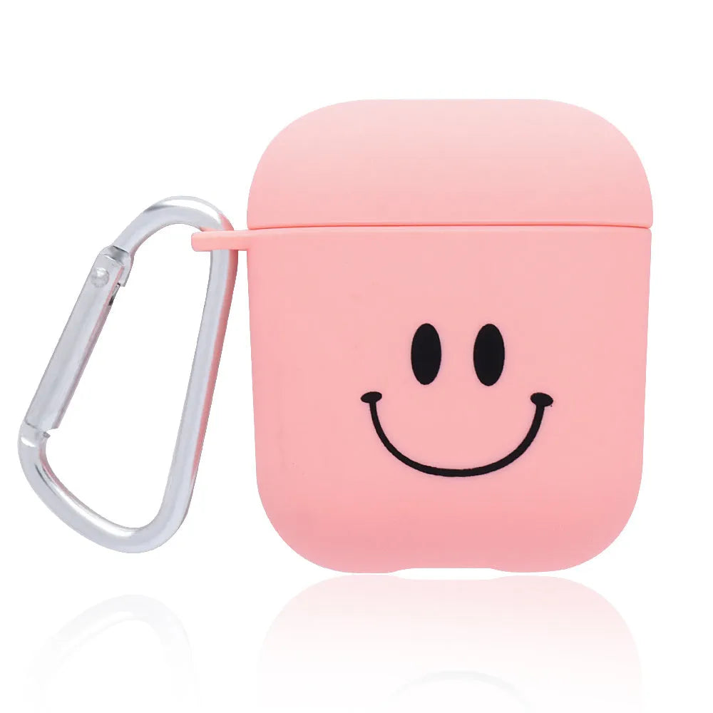 Black and pink AirPods earphone covers with decorative flower and smiley face back designs.