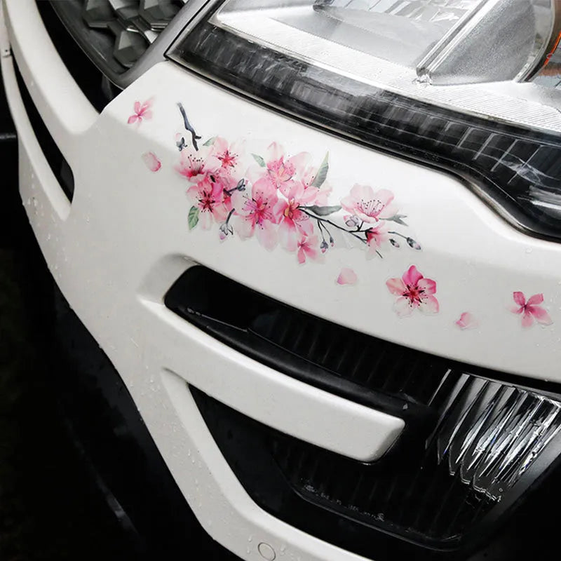 Pink cherry blossom car sticker on vehicle surface showing two size options for customisation
