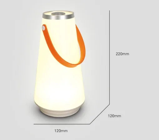 White rechargeable LED bedside lantern with warm light, shown next to a USB charging cable.