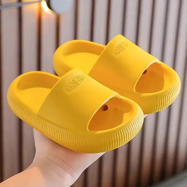 Brightly coloured children's EVA slippers with a textured non-slip sole, shown in multiple colour options.