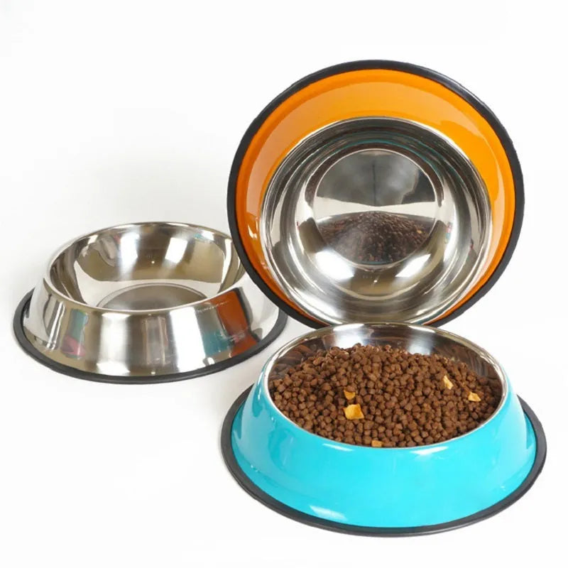 Stainless steel pet bowl inside a colourful melamine bowl, showing non-slip rubber base, in orange colour.