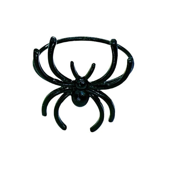 Six black spider-shaped alloy napkin rings for Halloween table decoration
