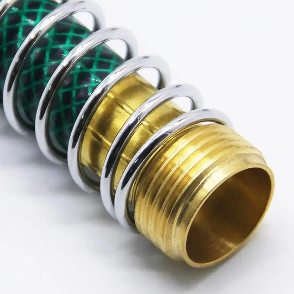 Brass garden hose connector with internal spiral spring, 15cm long with 3/4 inch threaded ends.