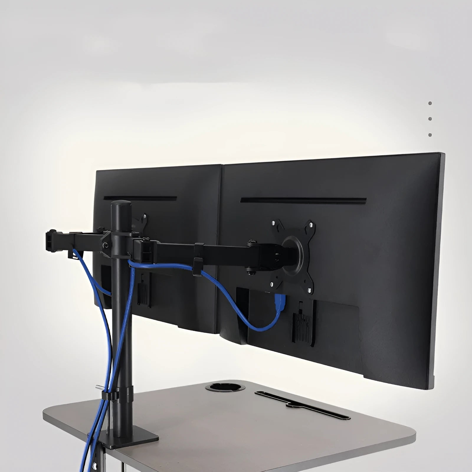 Silver computer monitor lifting rotating bracket on a desk for 13 to 32 inch screens