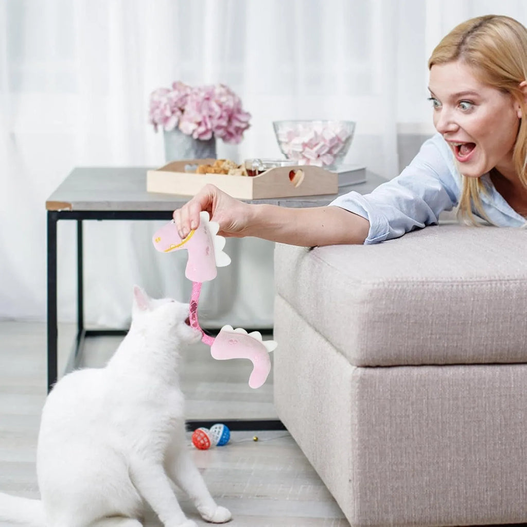 Four-piece cat toy bundle showing chew toy, plush mouse, fish, and bunny in pink, purple, and yellow colours.
