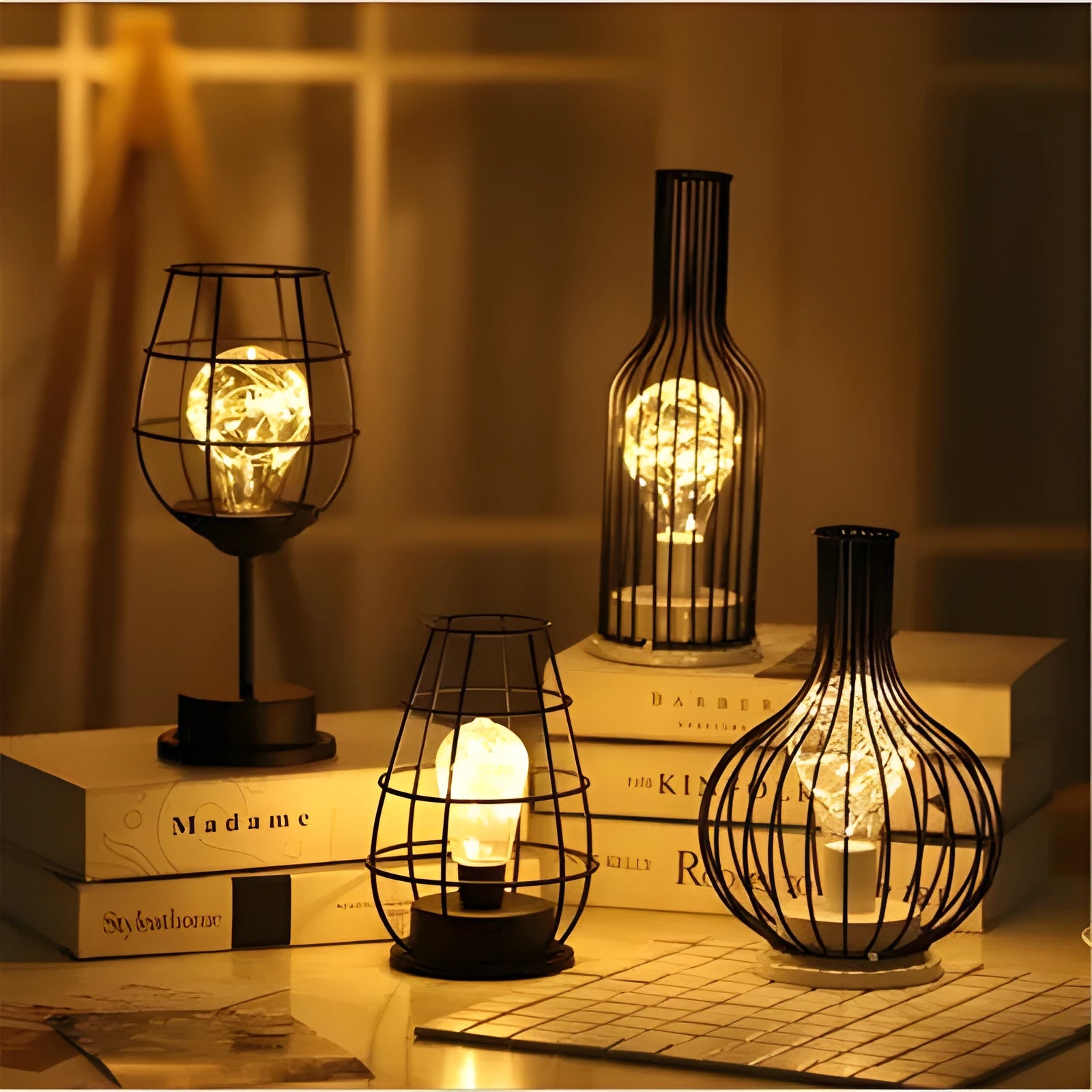 Minimalist wrought iron hollow table lamp in red wine glass style with warm white glow.