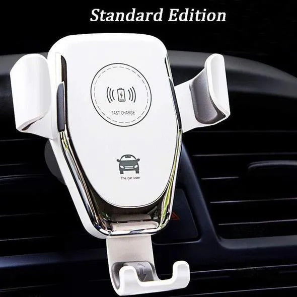 Black wireless car charger mounted on a car air vent, holding an iPhone.