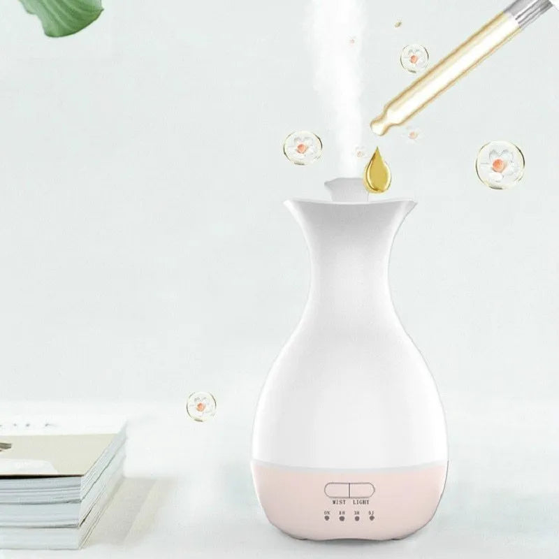 White or pink ultrasonic aromatherapy diffuser with 200ml tank capacity and coloured night light function