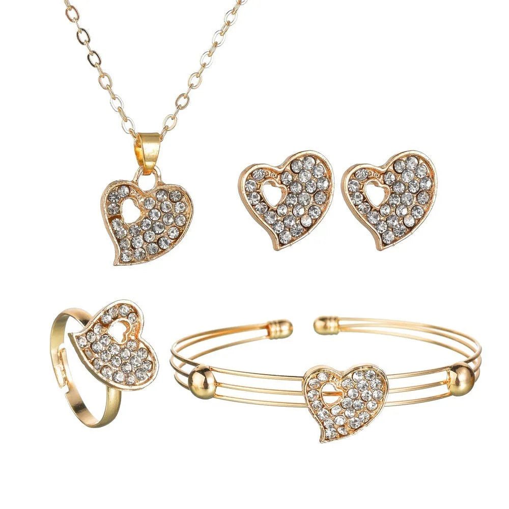 Gold electroplated women's jewellery set with love bell patterns including earrings, pendant and adjustable bracelet