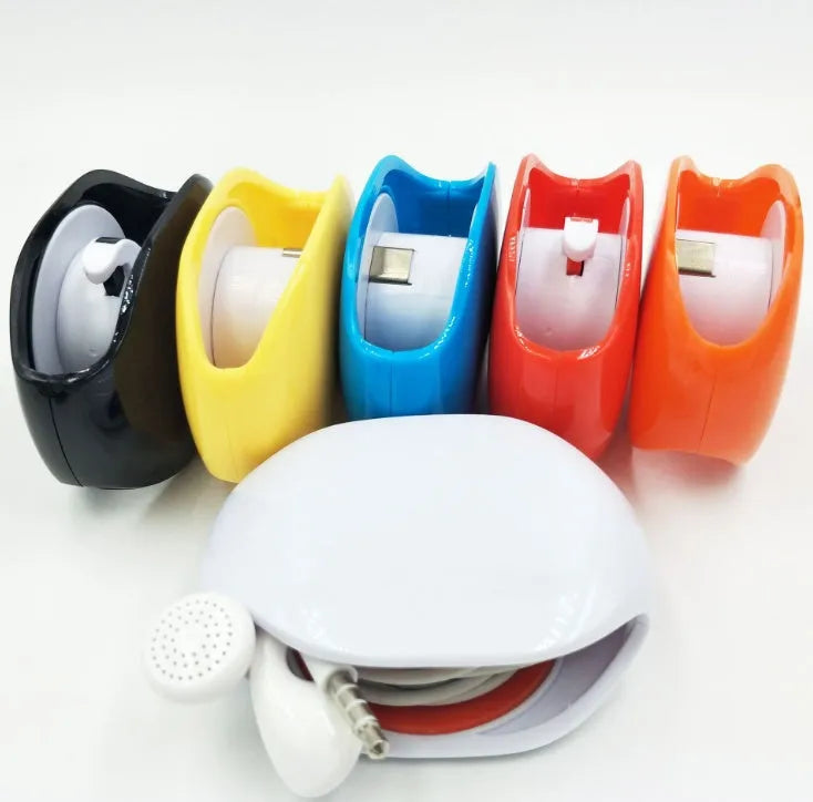 Automatic earphone cable winder retractor in assorted colours on a white background.