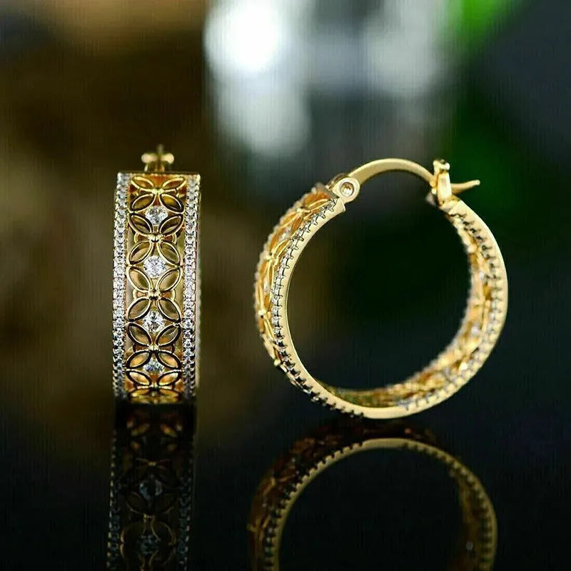 Copper ear clips with horse eye, flower and butterfly design on geometric shapes in yellow gold finish