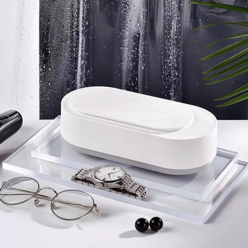 White portable ultrasonic cleaning machine with digital display and stainless steel tank.
