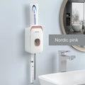 Automatic toothpaste dispenser unit mounted on a bathroom wall in blue colour.