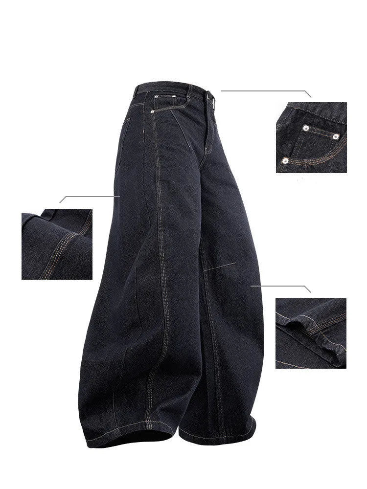 Men's wide leg denim trousers in original cow colour, showing mid waist and loose leg fit.