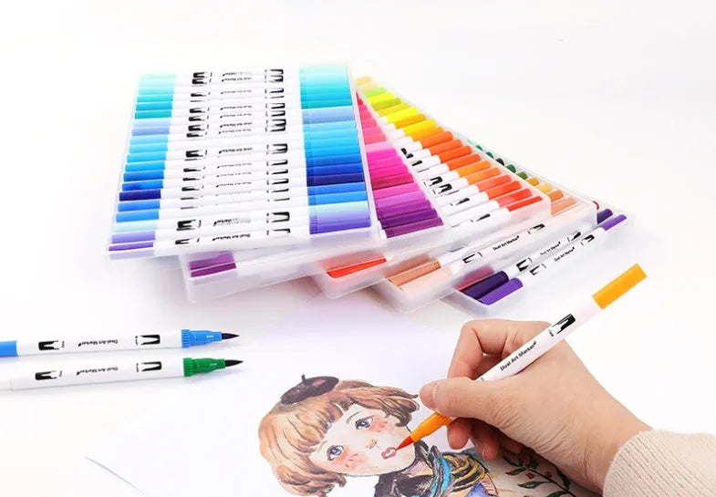 Set of watercolour brush pens in assorted colours, showing fine tips, arranged in a case.