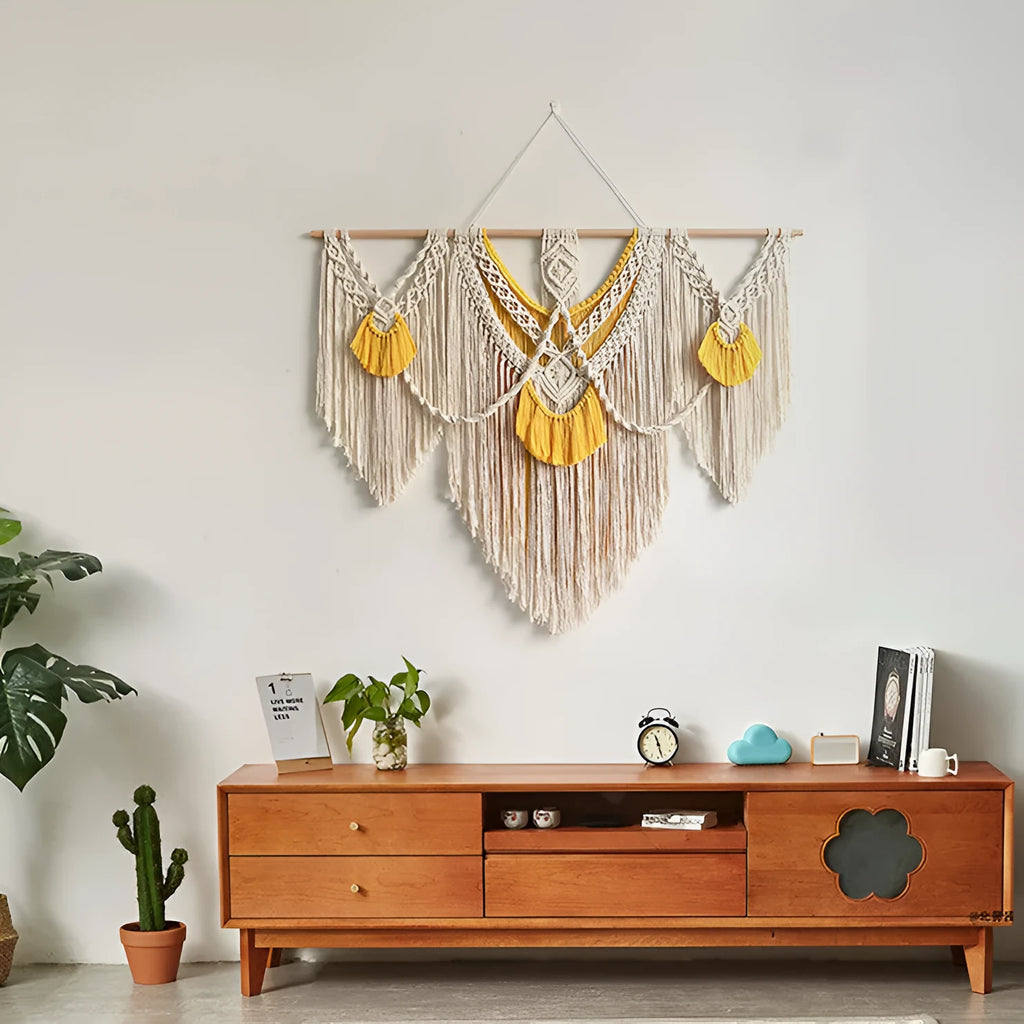 Creamy white hand-woven cotton Nordic tapestry hanging on a wall, 120cm wide by 95cm high.