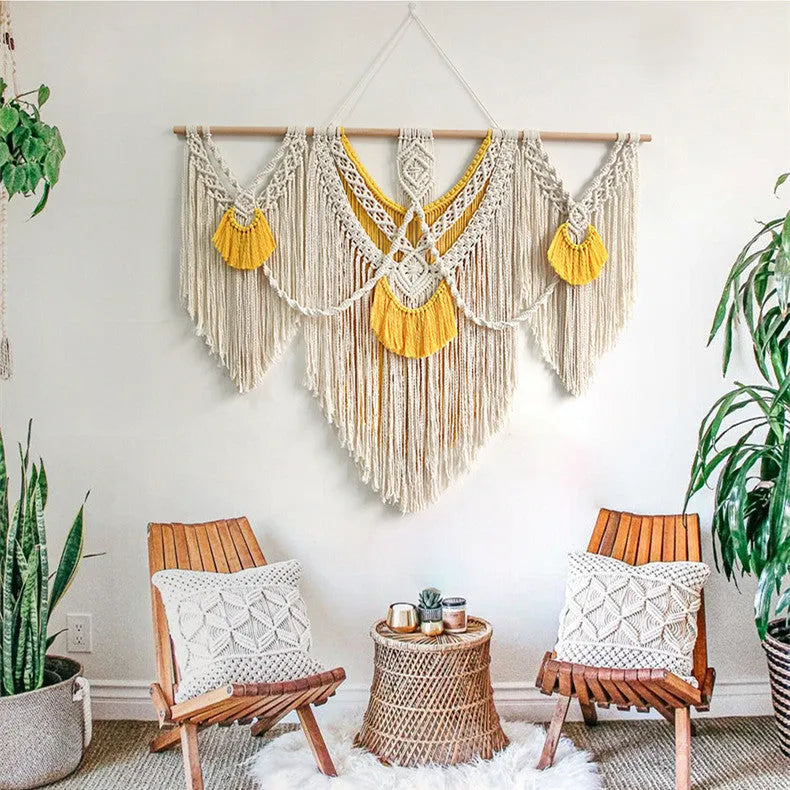 Creamy white hand-woven cotton Nordic tapestry hanging on a wall, 120cm wide by 95cm high.