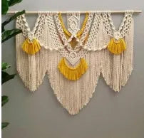 Creamy white hand-woven cotton Nordic tapestry hanging on a wall, 120cm wide by 95cm high.