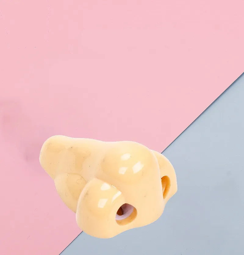 Flesh coloured geometry-shaped plastic pencil sharpener with big nostril opening