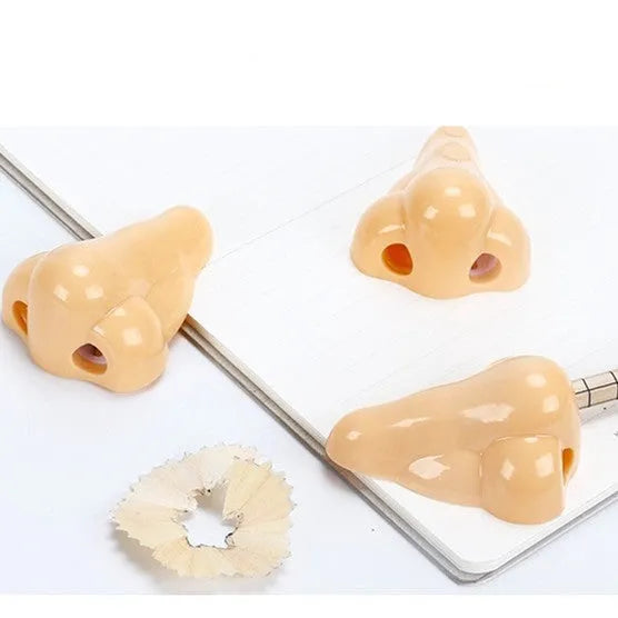 Flesh coloured geometry-shaped plastic pencil sharpener with big nostril opening