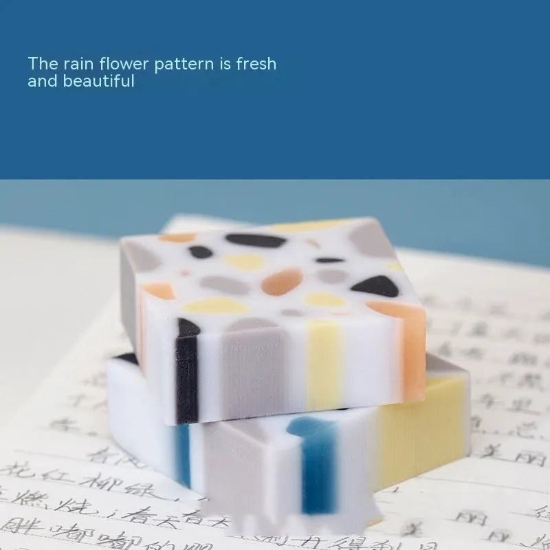 White rubber brick eraser for clean pencil mark removal.