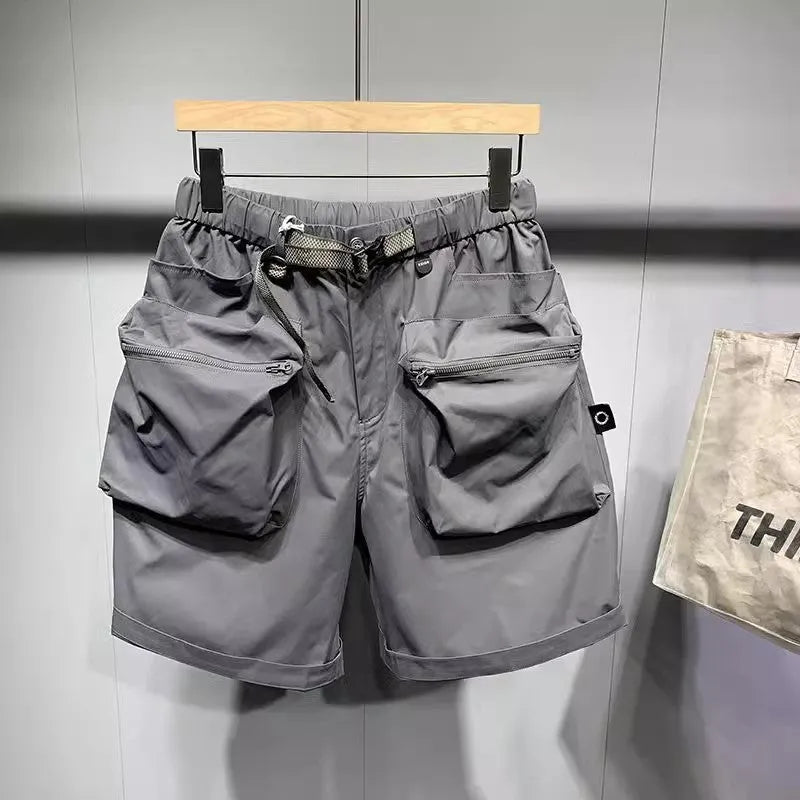 Men's black loose-fit workwear shorts with pockets in above-knee length
