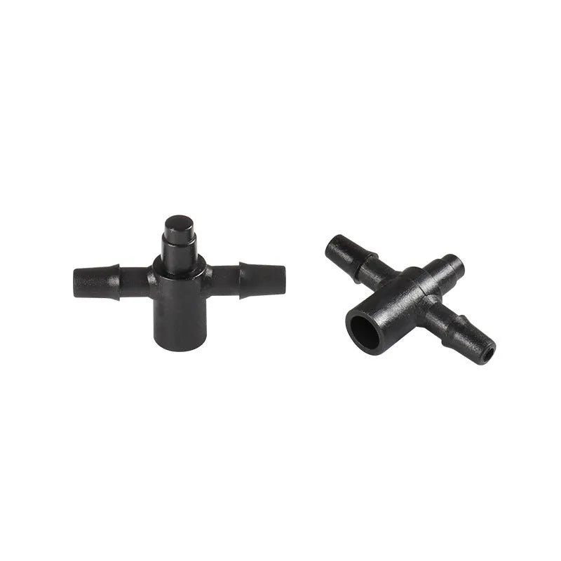 White polyethylene tee water distribution joint connector for irrigation systems.