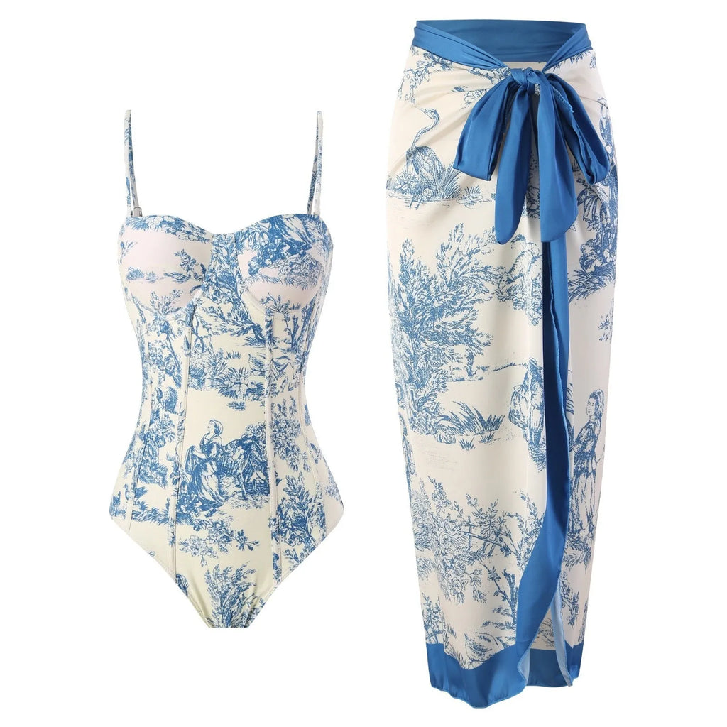 Women's blue patterned one-piece swimsuit with a skirt, made from polyester fabric.