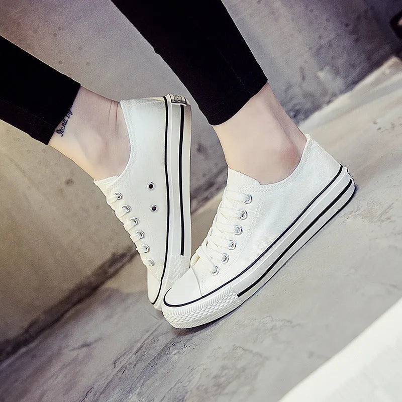 Women's solid colour canvas casual shoes shown in black, white black, white red, and all black colour options.