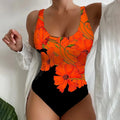 Women's one-piece swimsuit with a 3D printed pattern in orange red, made from Lycra fabric.