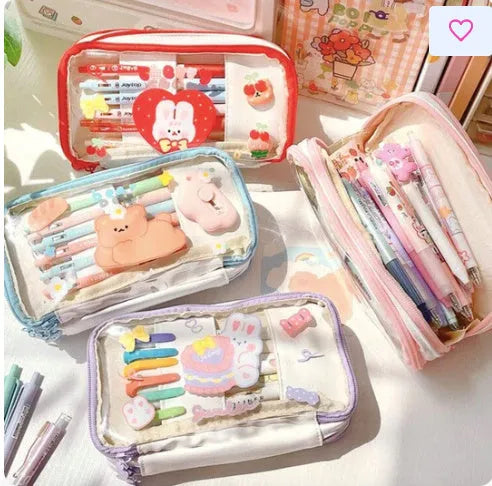 Transparent pen case with Japanese girl and heart graphic in pink or red colour options.