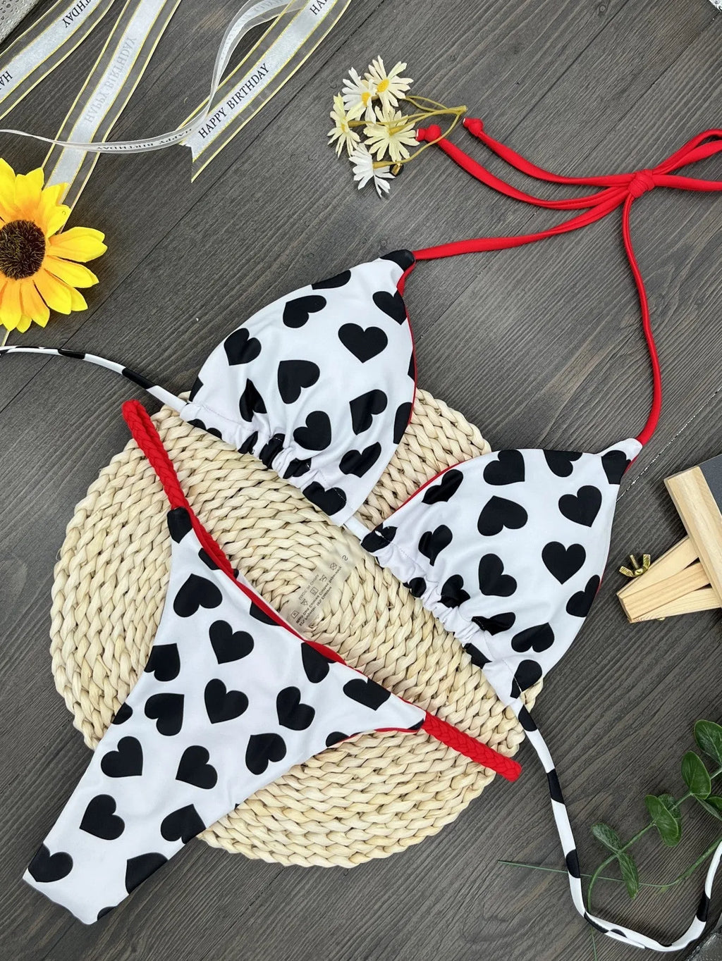 Red backless women's swimsuit with heart print design and high-cut legs