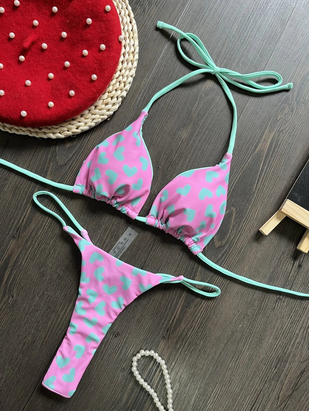 Red backless women's swimsuit with heart print design and high-cut legs